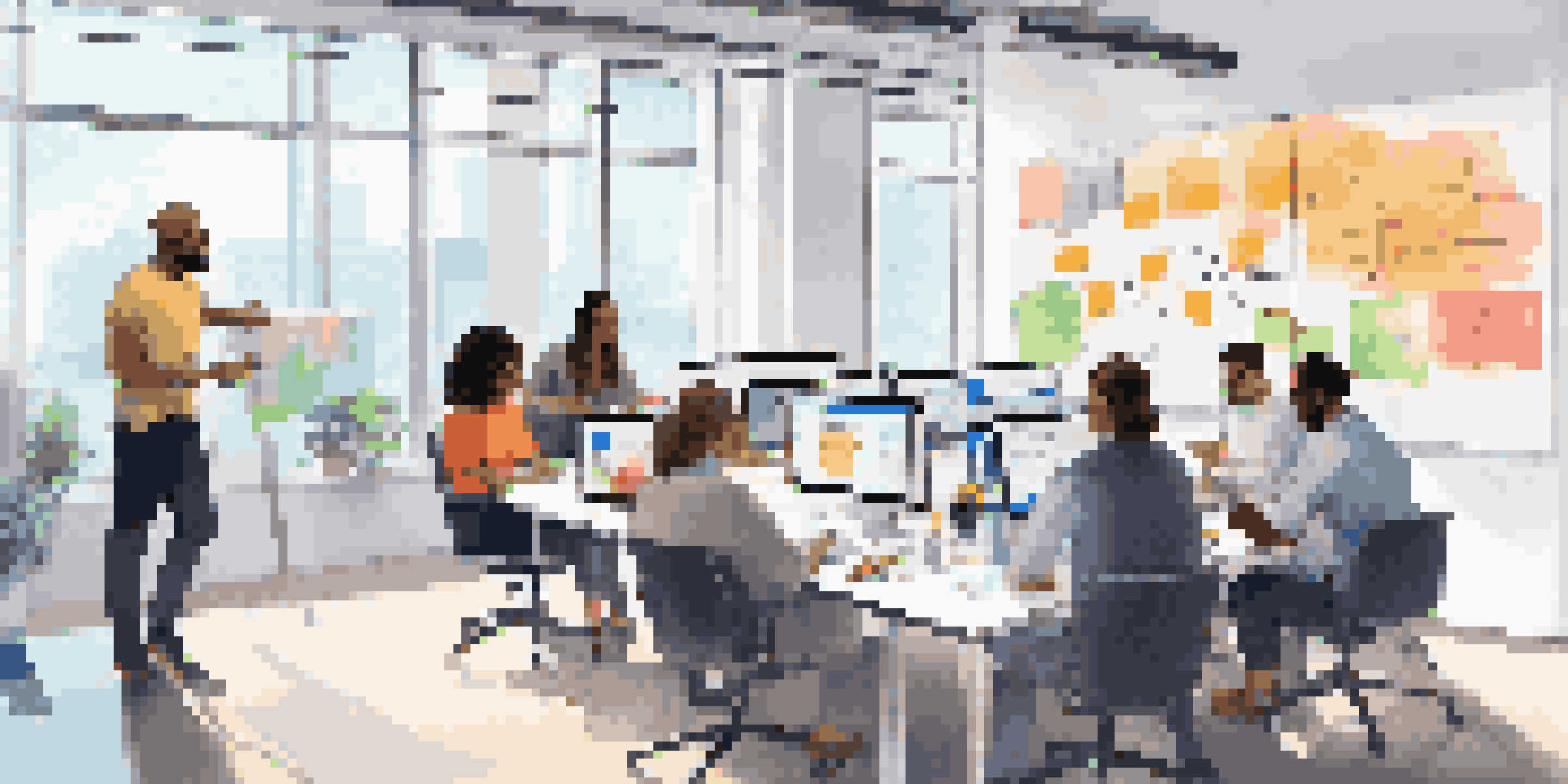 A diverse team in a bright office brainstorming together using a virtual whiteboard and project management tools.