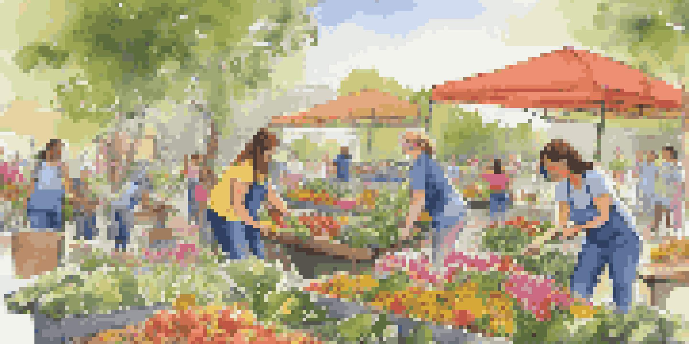 A diverse group of volunteers in a park, with a young woman planting flowers and others setting up a food distribution table.