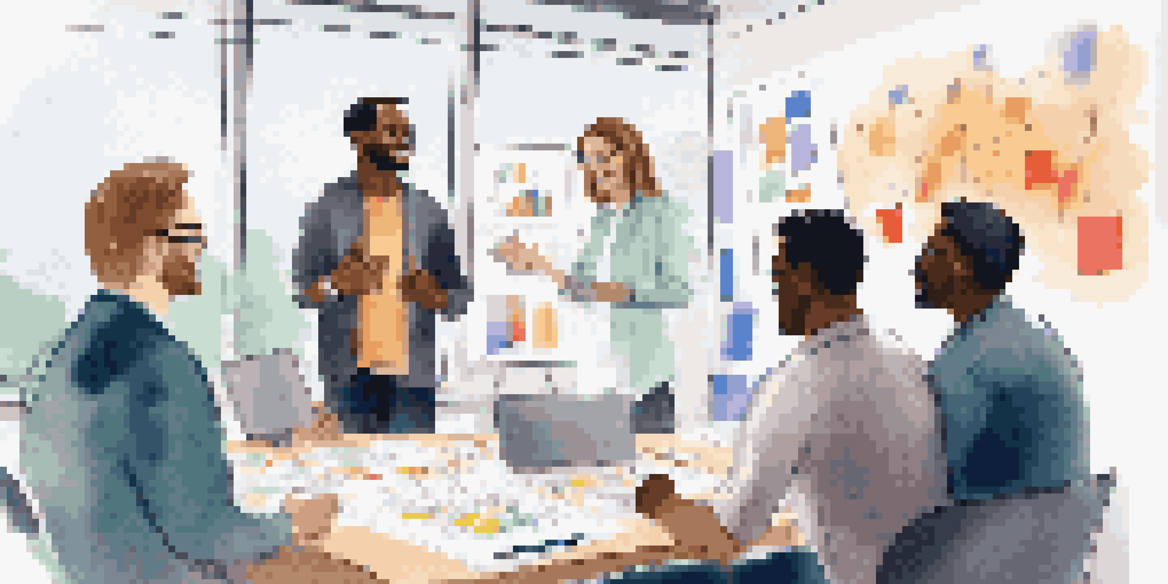 A diverse group of professionals having a collaborative meeting in a bright office environment, with a whiteboard filled with notes.