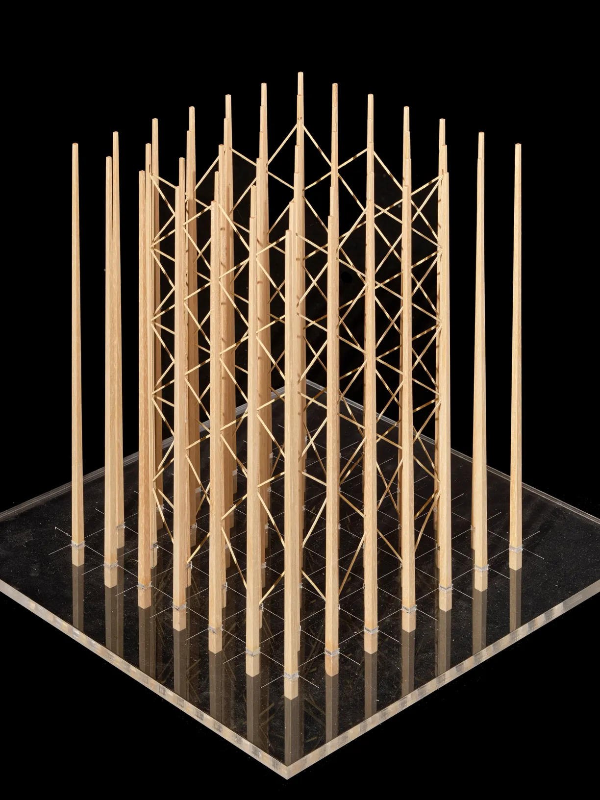 a model of a structure made of wooden sticks