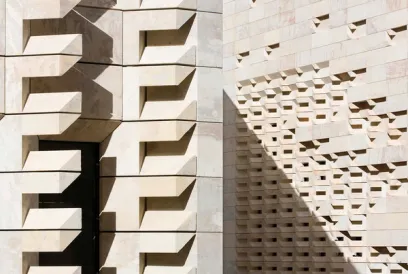 A close up of a building with a geometric pattern on it