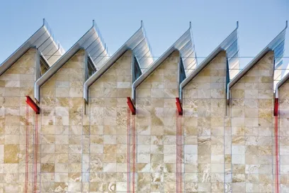 A close up of the roof of a building with a blue sky in the background