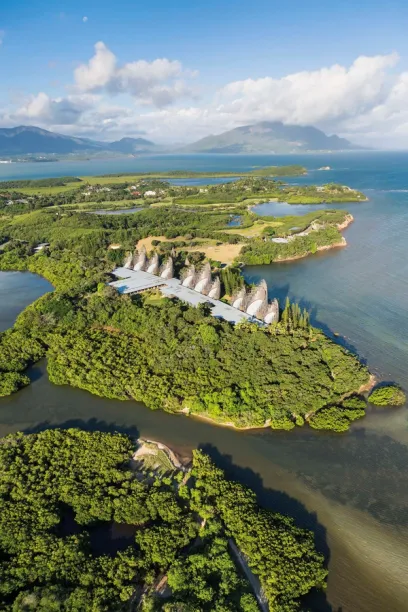 An aerial view of a small island in the middle of a body of water