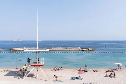 A lifeguard tower on a beach next to the ocean