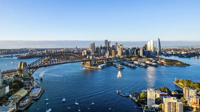 An aerial view of the sydney harbor bridge and city skyline