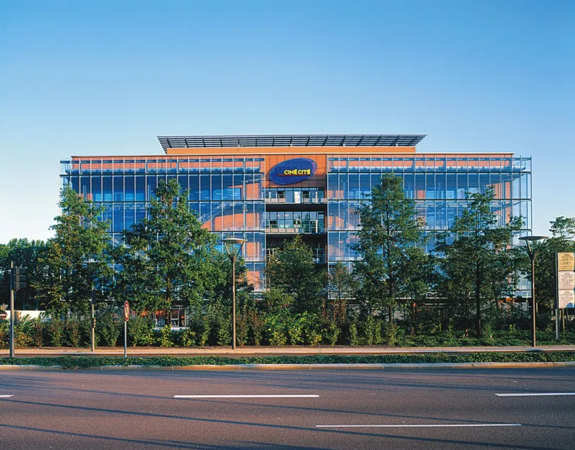 A large building with a blue sign that says chevys on it