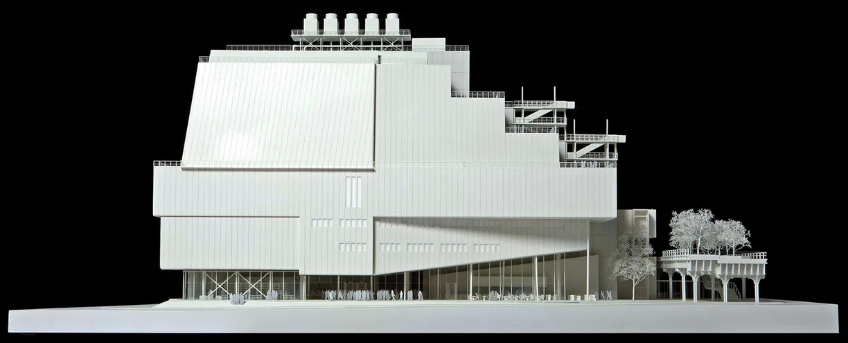 A white model of a building on a black background