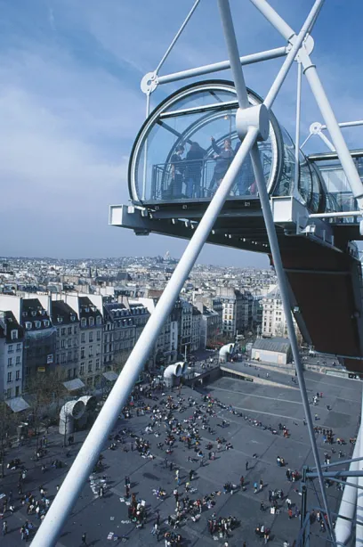 A view of a city from the top of a ferris wheel