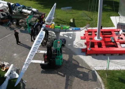 an aerial view of a forklift carrying a sailboat .