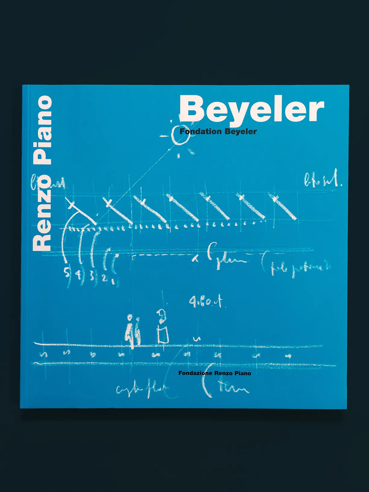 A blue book titled beyeler by renzo piano