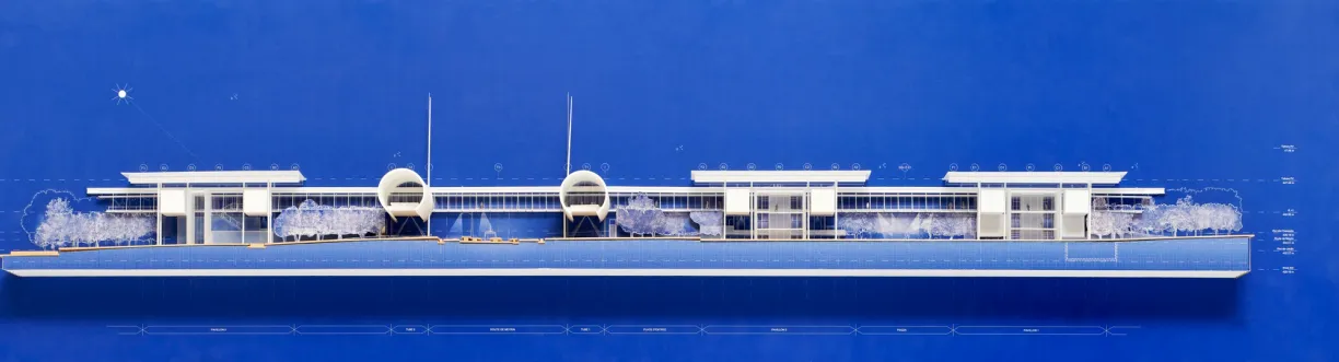 a blueprint of a building on a blue surface .