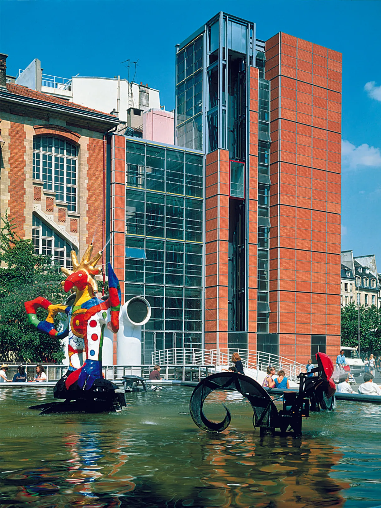 a large building with a fountain in front of it