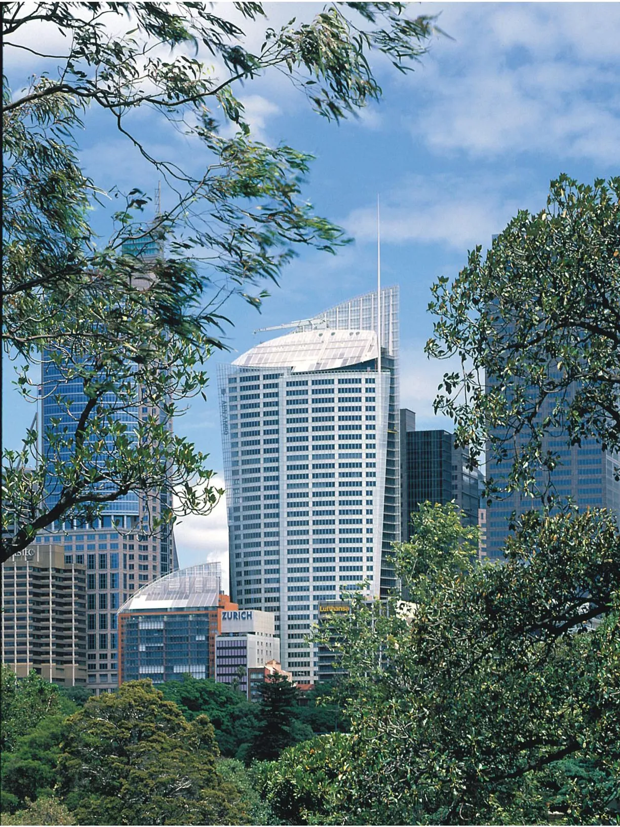 a city skyline with a building that says ' a & a ' on it