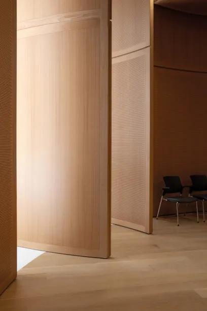 A room with wooden walls and chairs in it