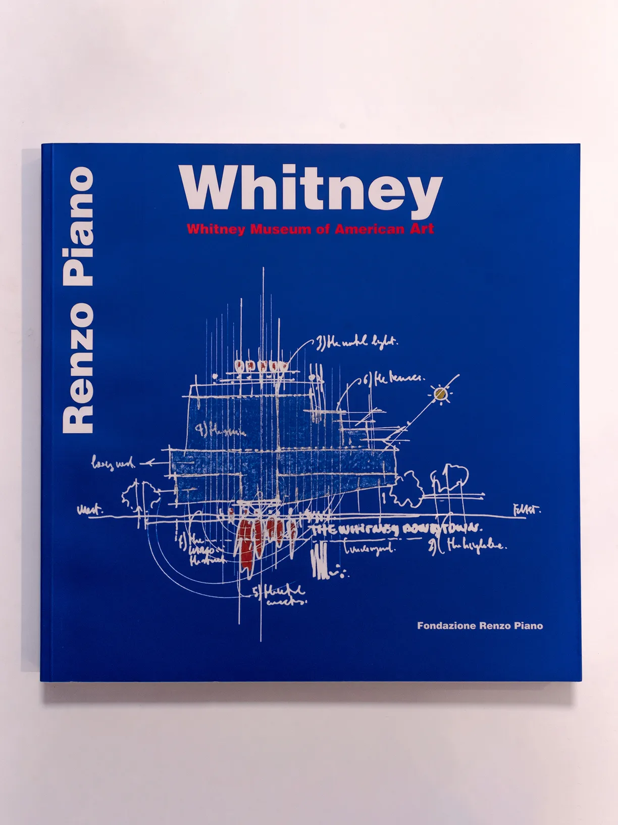 A blue book titled whitney by renzo piano