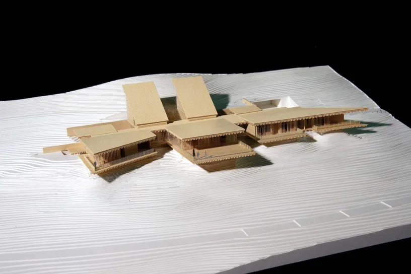 A model of a house sitting on top of a hill