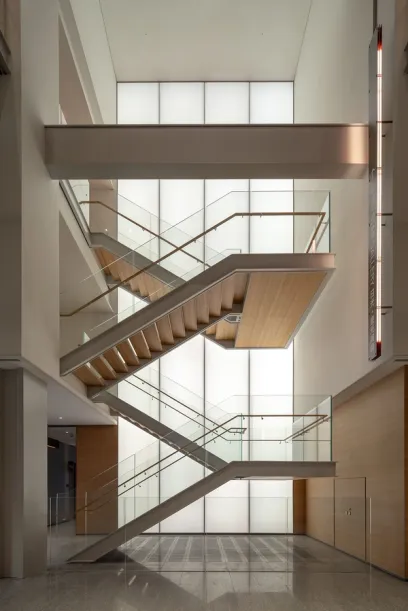 A large staircase in a building with a sign that says ' stairs ' on it