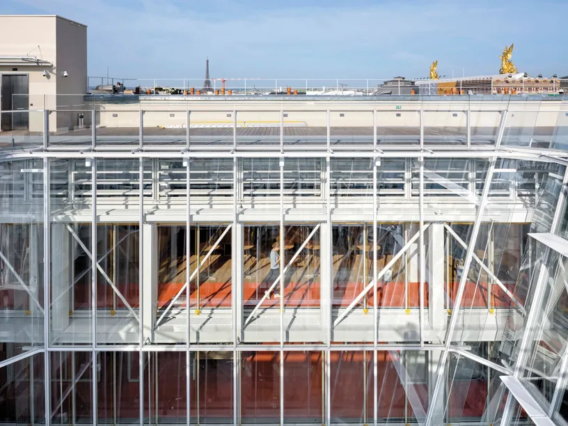 A large building with a lot of windows and a balcony