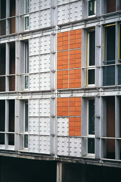 there is a staircase leading up to the second floor of the building .