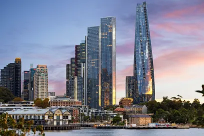 A city skyline with a large body of water in the foreground