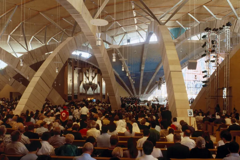 A large group of people are sitting in a church