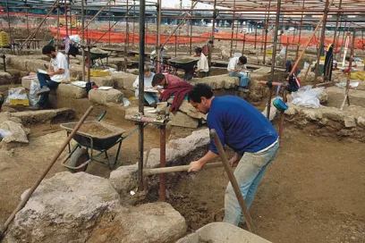 A group of people are working on an archaeological site