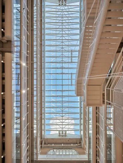 Atrium glazed roof with motorized sunshades