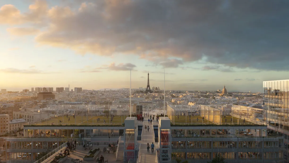 Modern rooftop with a green field and walkways overlooking the Paris skyline and Eiffel Tower at sunset.