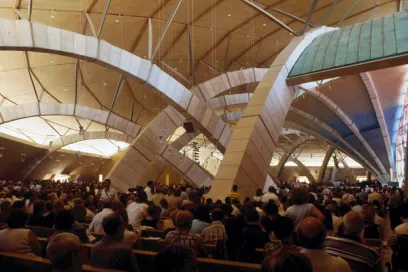 A large group of people are sitting in a church