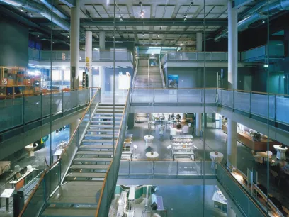 A large building with stairs leading up to the second floor