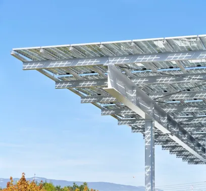 A row of solar panels are sitting on top of a metal structure