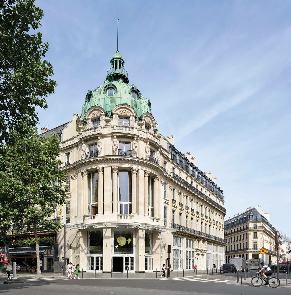 A large building with a green dome on top of it