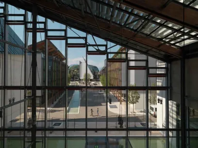 a view of a city through a large window of a building .