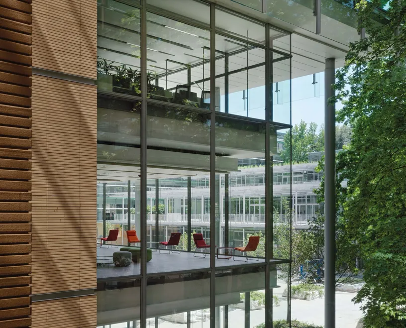 A large building with a lot of windows and chairs in it