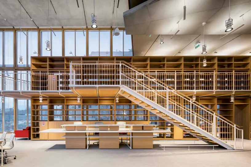 there is a staircase leading up to the second floor of the building .