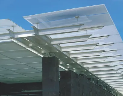 The roof of a building with a clear glass canopy
