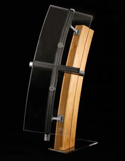 a cross made of glass and wood with a black background