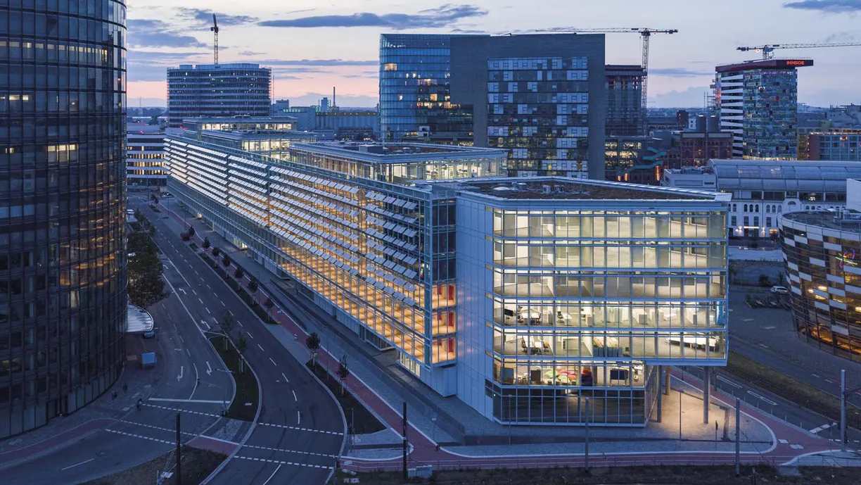 an aerial view of a large building in a city at night .