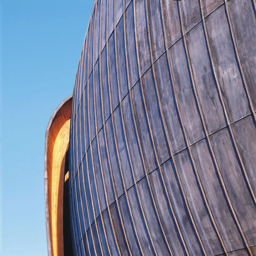 A close up of a building with a blue sky in the background