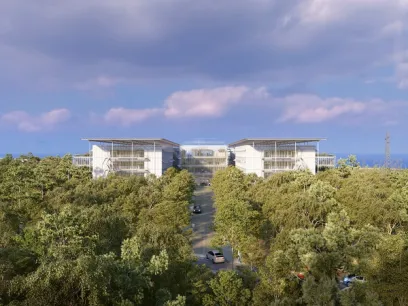 An artist 's impression of a large building surrounded by trees