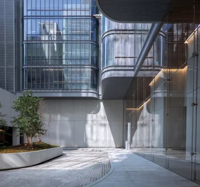 a large building with a lot of windows and a tree in the middle of it .