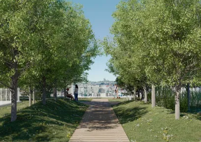 A wooden path bordered by trees and grass leads to a cityscape view with people.