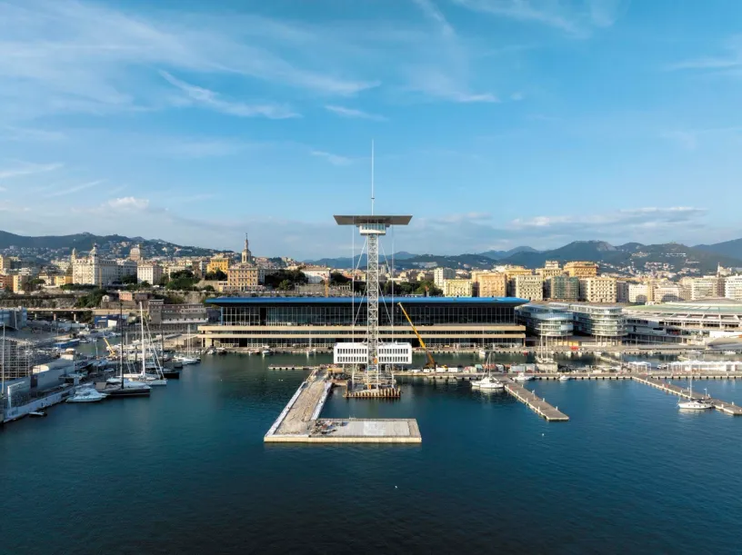 a large building is being built in the middle of a harbor .