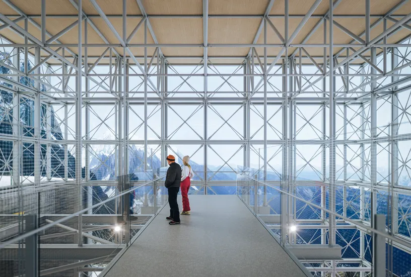 an aerial view of a building with a large auditorium in the middle