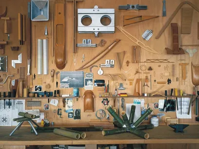 A wooden wall with a lot of tools on it
