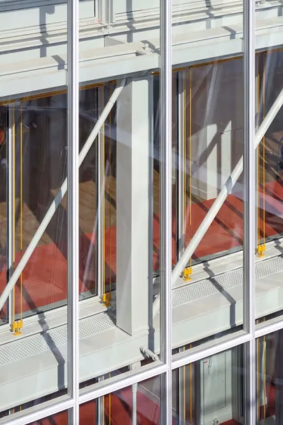 A building with a lot of windows and a red carpet