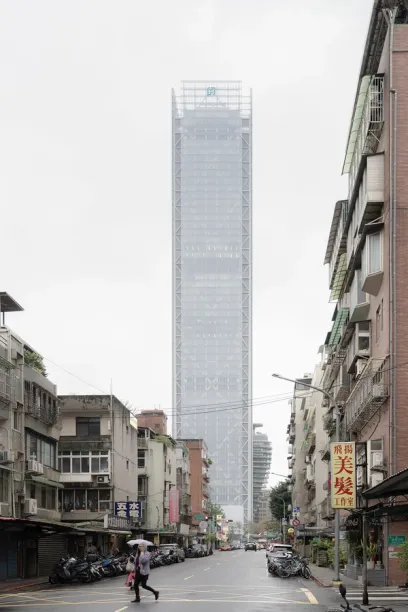 A very tall building is being built in a city