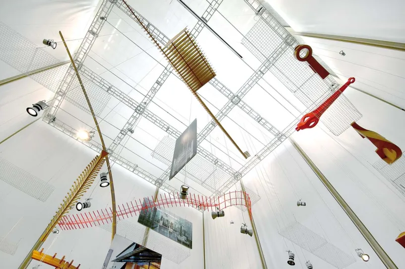 a ceiling with a lot of objects hanging from it .