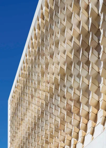 A brick wall with a blue sky in the background