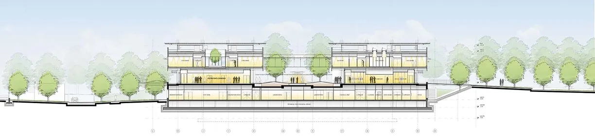 a cross section of a building with trees in the background .